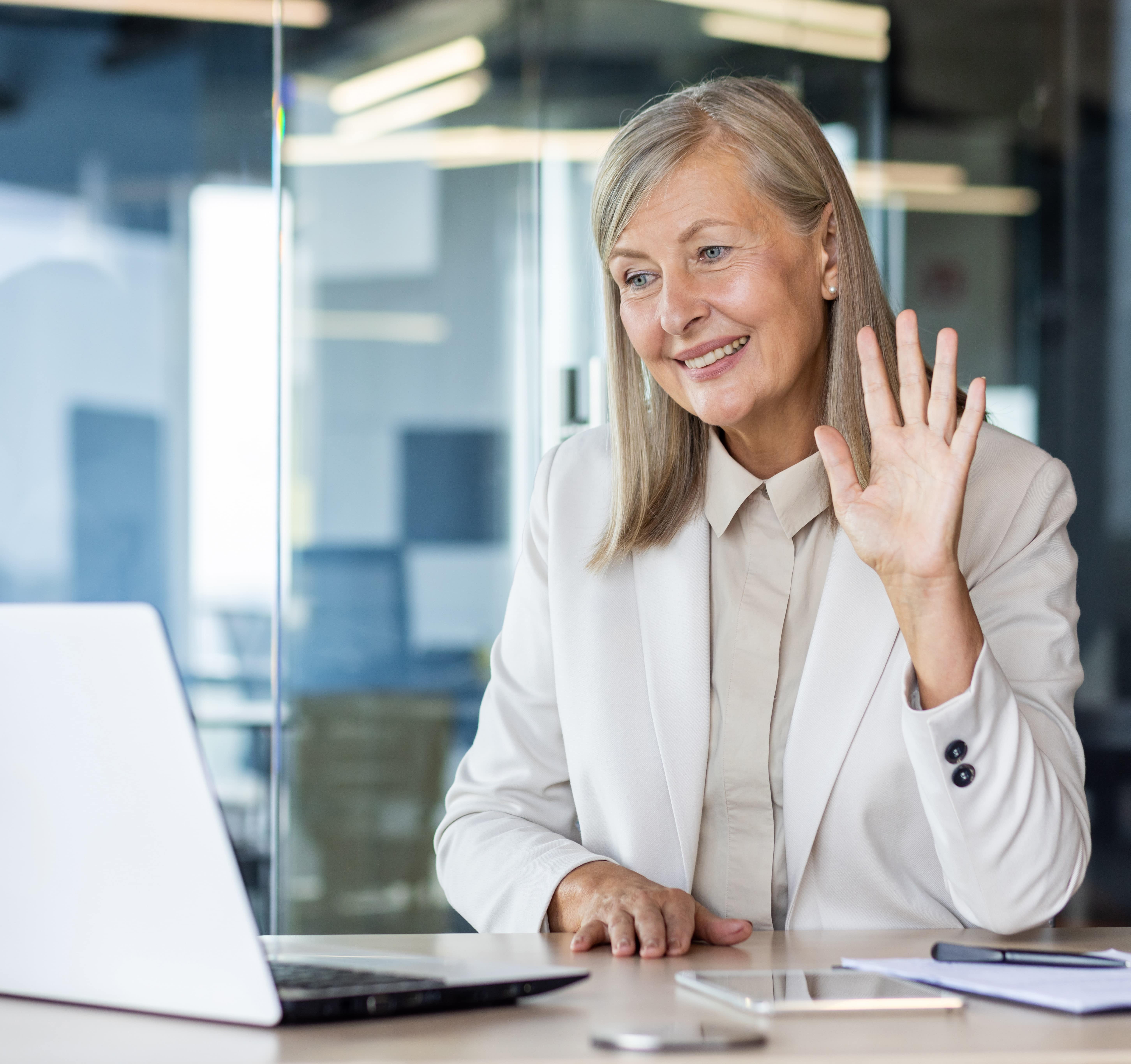 Image of a female executive actively participating in an online executive coaching session