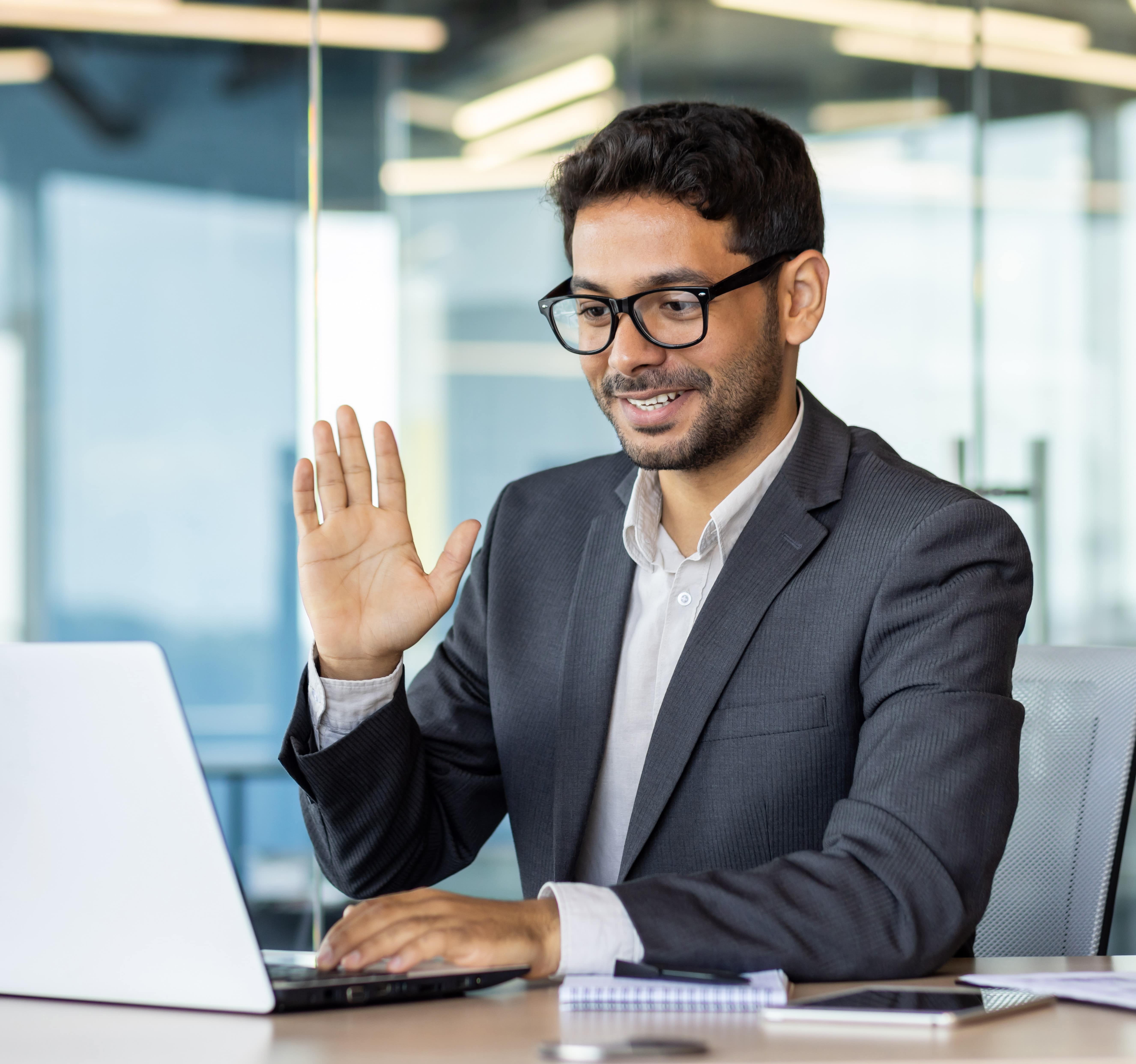 Image of a male leader actively participating in an online leadership coaching session
